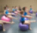 Group of dancers on yoga balls