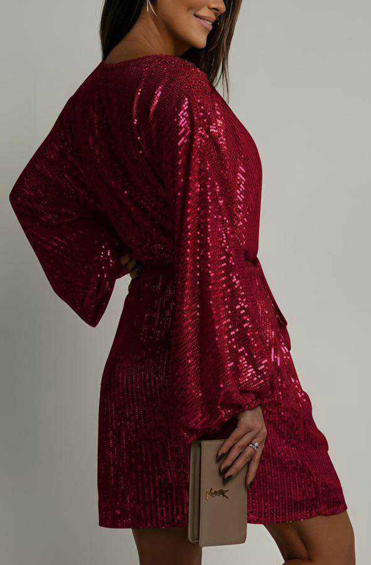 Side view of red sequin mini dress with balloon sleeves