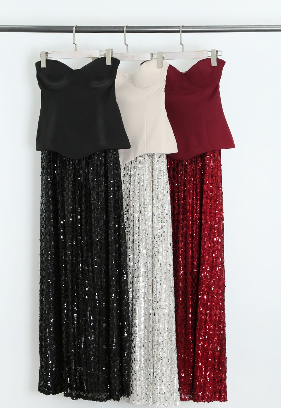 Product photo of strapless sequin coctail dress, in colours balck, deep red and cream