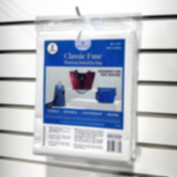 Classic Fuse Woven Interfacing hanging from a wall hook