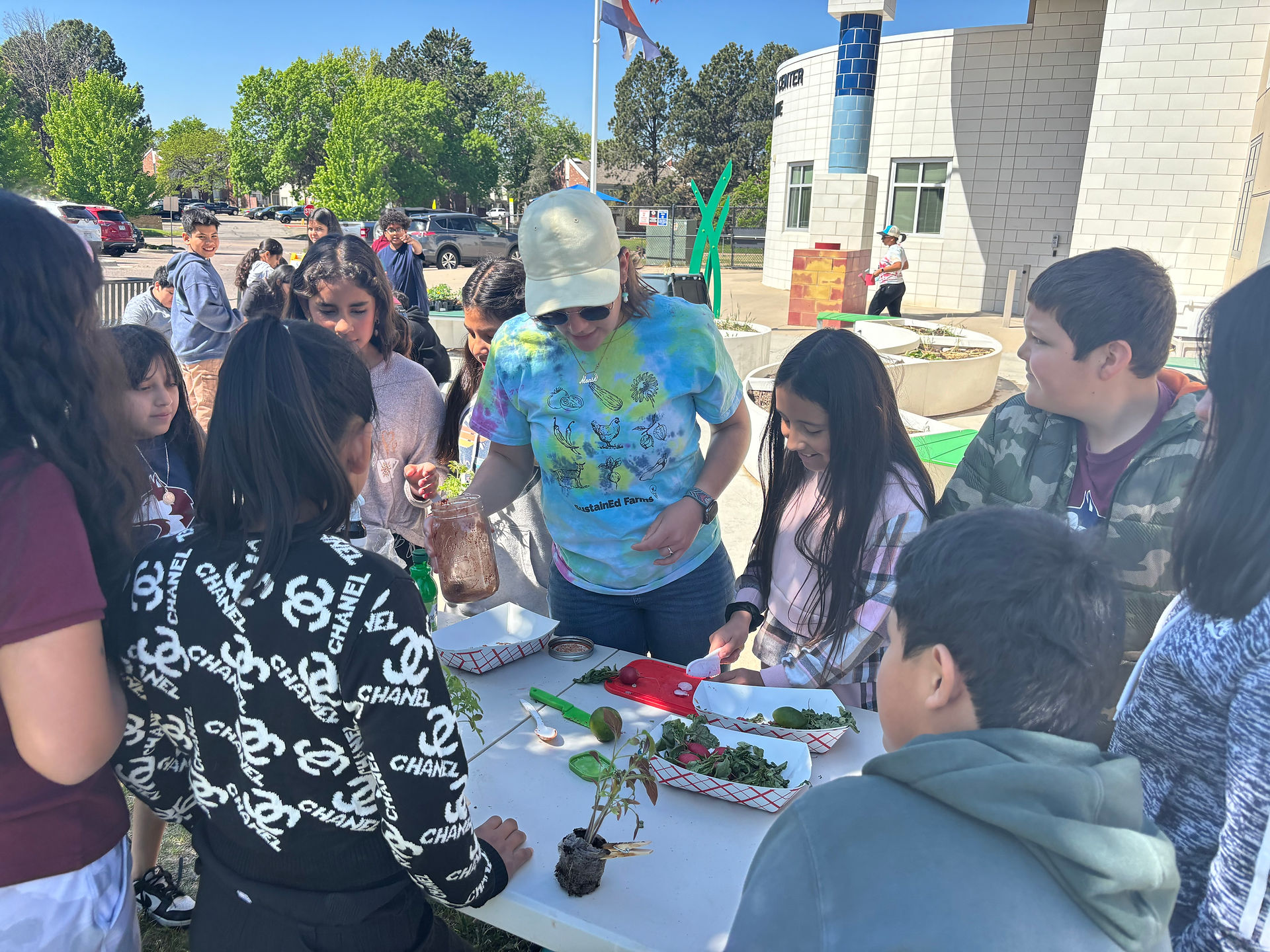 Staff explains, to students, how to make homemade tajin
