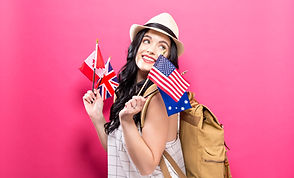 Девушка с флагами англоговорящих стран в руках.jpg