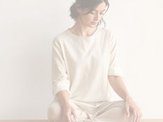A woman feeling calm with a simplified task list