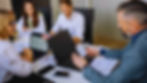 Employees discussing a contract