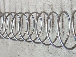 Tall narrow spiral track element for a rolling ball sculpture