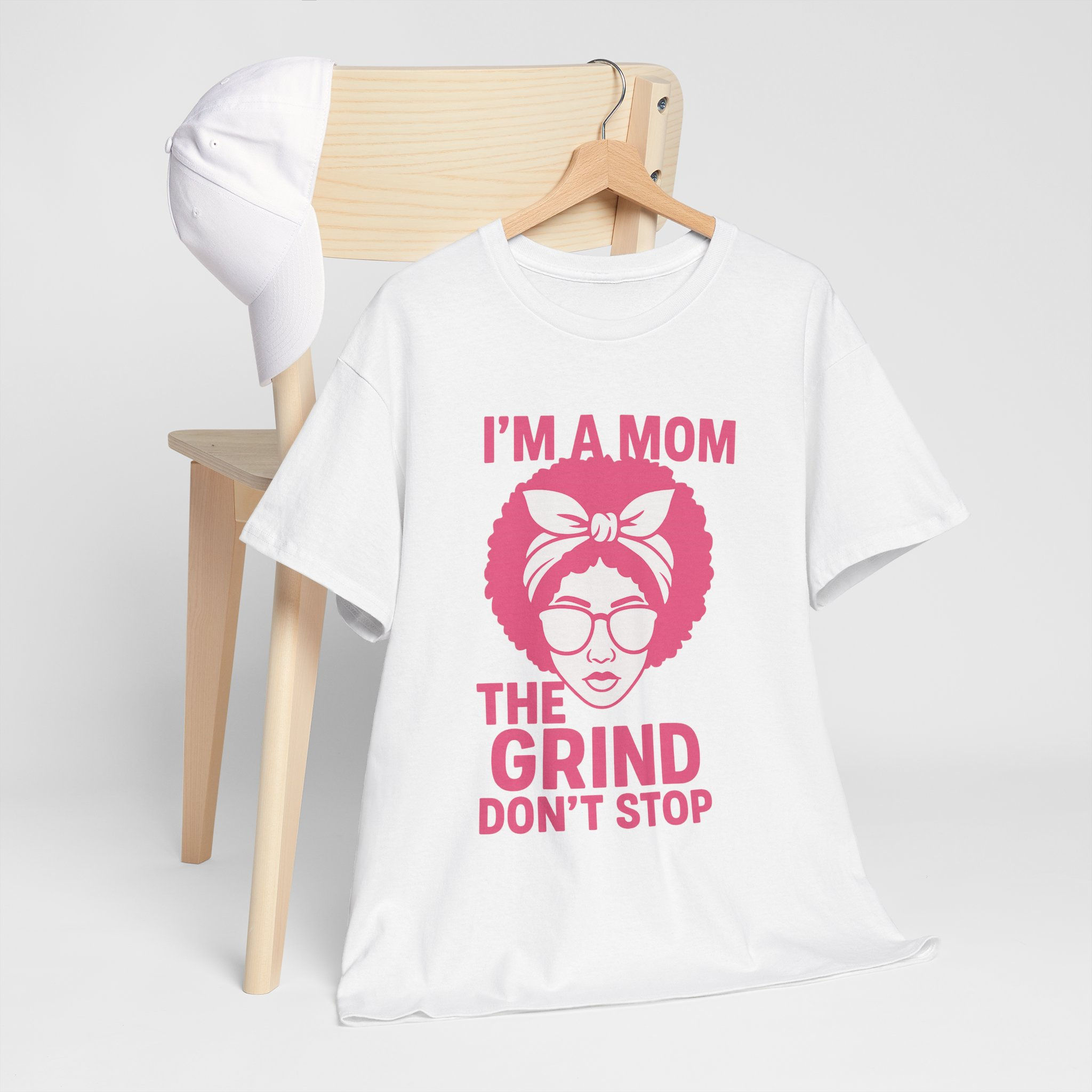 "I'm a Mom, The Grind Don't Stop" Heavy Cotton Tee