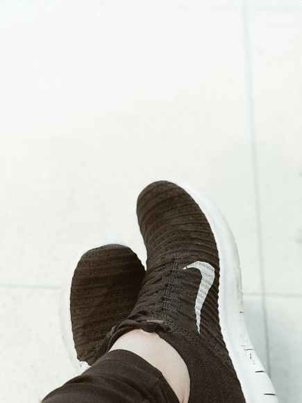 close up photography of white and black nike shoes