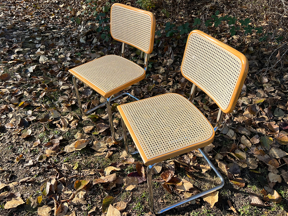 A set of beech Cesca chairs with freshly restored pre-woven cane seats, showcased against Alberta’s vibrant outdoor scenery.