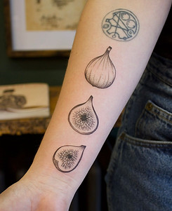 black and grey illustrative fine line fig on arm done in toronto