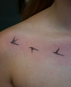 black and grey fine line birds on shoulder done in toronto