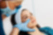 Attractive young woman is getting a rejuvenating facial injections at beauty clinic.