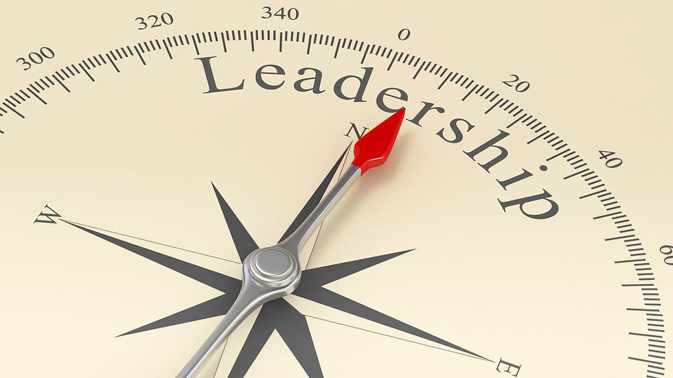 Compass with red needle pointing to the word "Leadership" on a beige background, evoking guidance and direction.