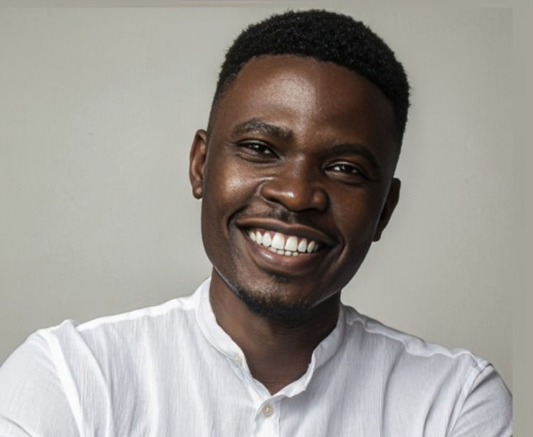 Smiling person wearing a white shirt, set against a neutral background, conveying a cheerful mood.