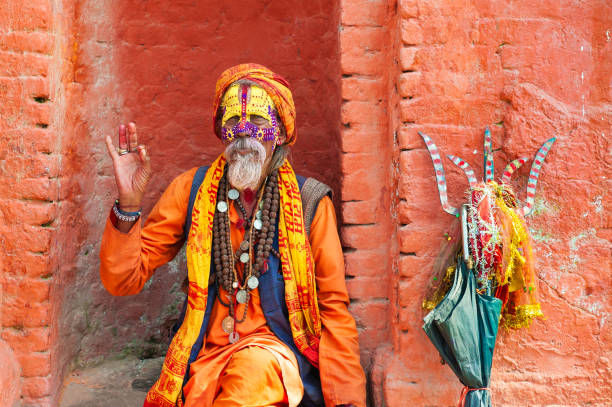 Sadhu holy man in traditional clothes in Pashupatinath Temple in Kathmandu