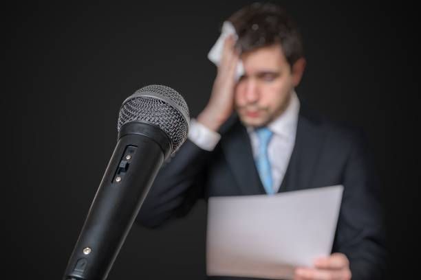 Microphone in front of a nervous man