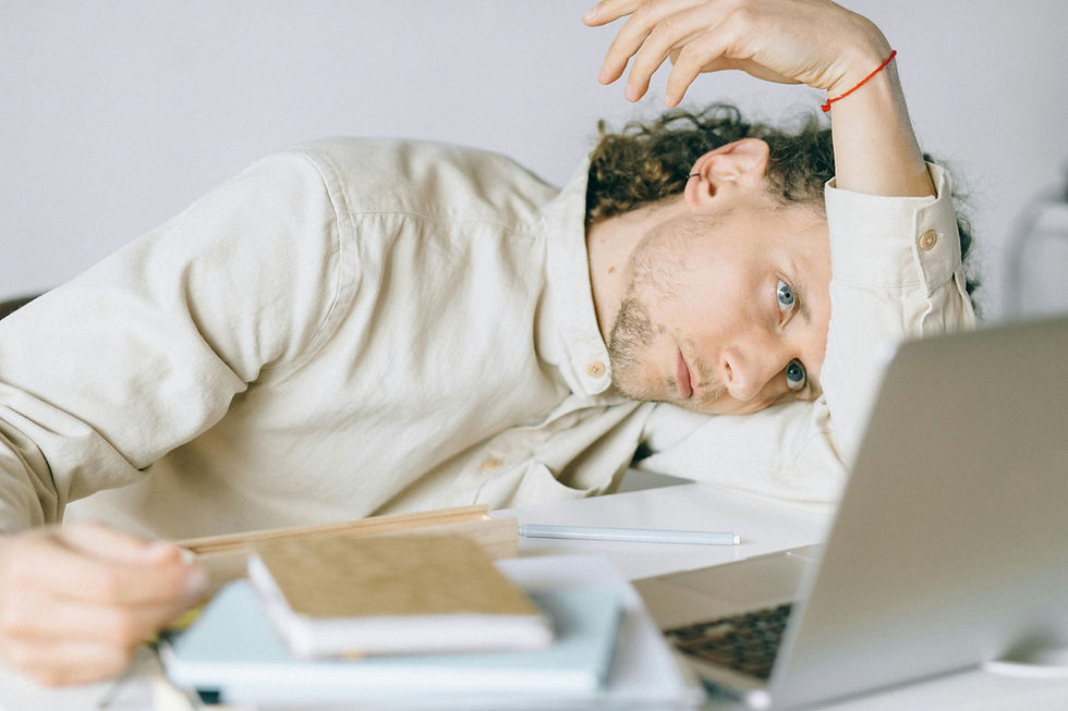 a tired man realizing that burnout is a business problem
