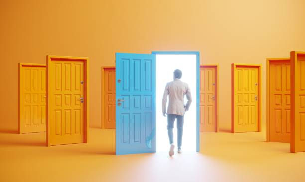Man walks through a glowing blue door in a room of yellow doors, with bright white light spilling into the orange space.