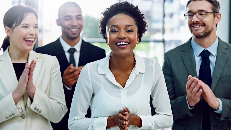 people clapping and smiling at the woman in the middle