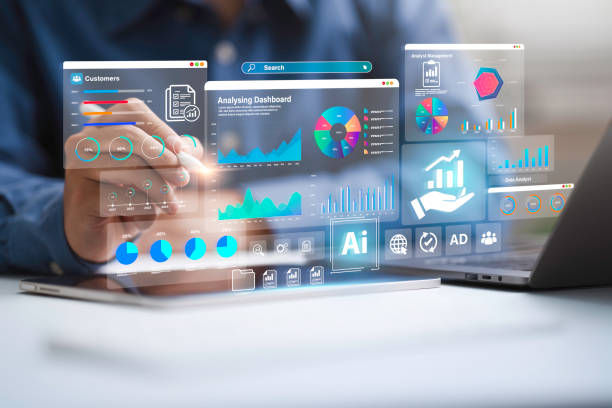 Hand taps a transparent AI analytics dashboard on a laptop, with charts and labels like Customers, Search, and Analysing Dashboard.