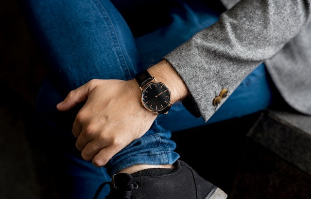 photo of a man wearing black risk watch