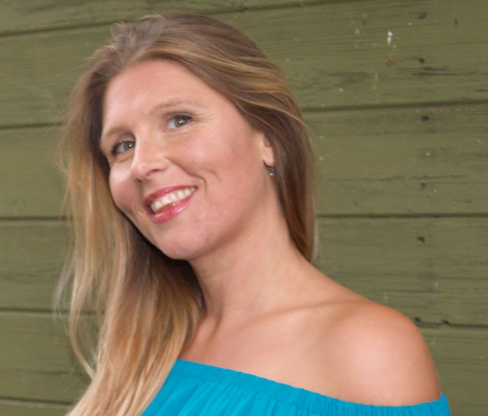 A smiling photo of Corinne Alexandra Winkworth