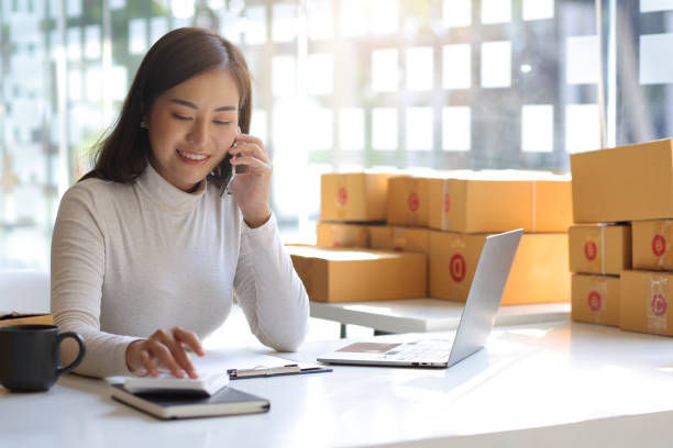 Businesswoman talking on clients using mobile phone