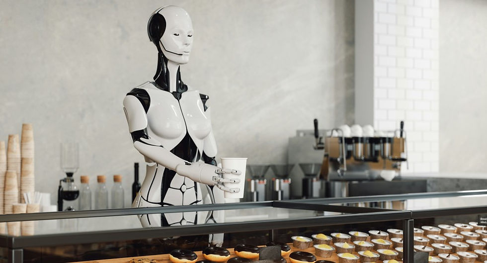 Humanoid robot stands behind a café counter holding a cup, with donuts in a glass case and espresso machines in the background.