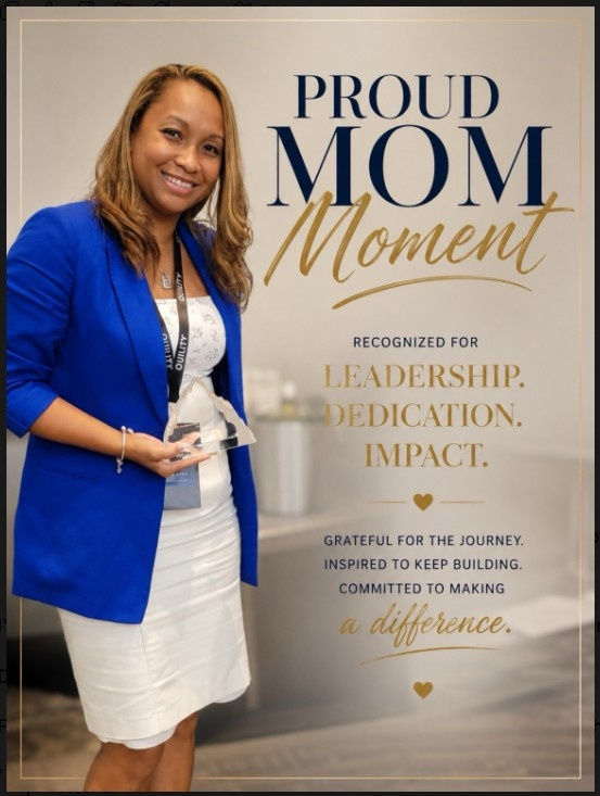 Smiling woman in blue blazer holds an award beside a Proud Mom Moment sign honoring leadership, dedication, and impact.
