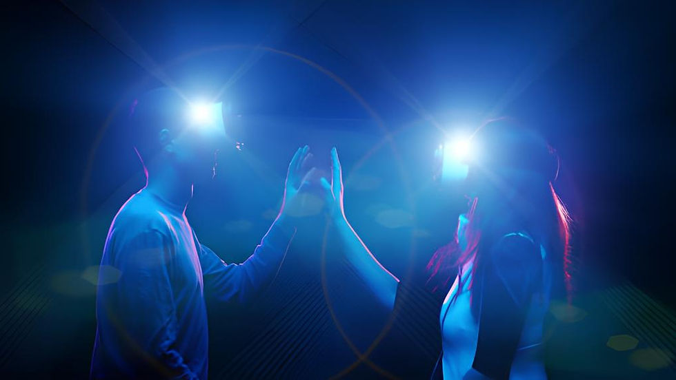 The image shows a man and a woman wearing virtual reality (VR) headsets, illuminated by blue and purple lights.