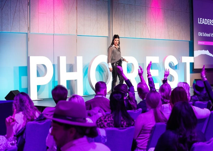 Transparent head profile with colorful spheres inside, simulating a brain on a black background. Warm red-orange glow suggests activity.
