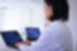 Doctor looking at screens of Magnetic Resonance Imaging
