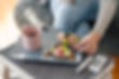 Young diabetic woman having breakfast at home
