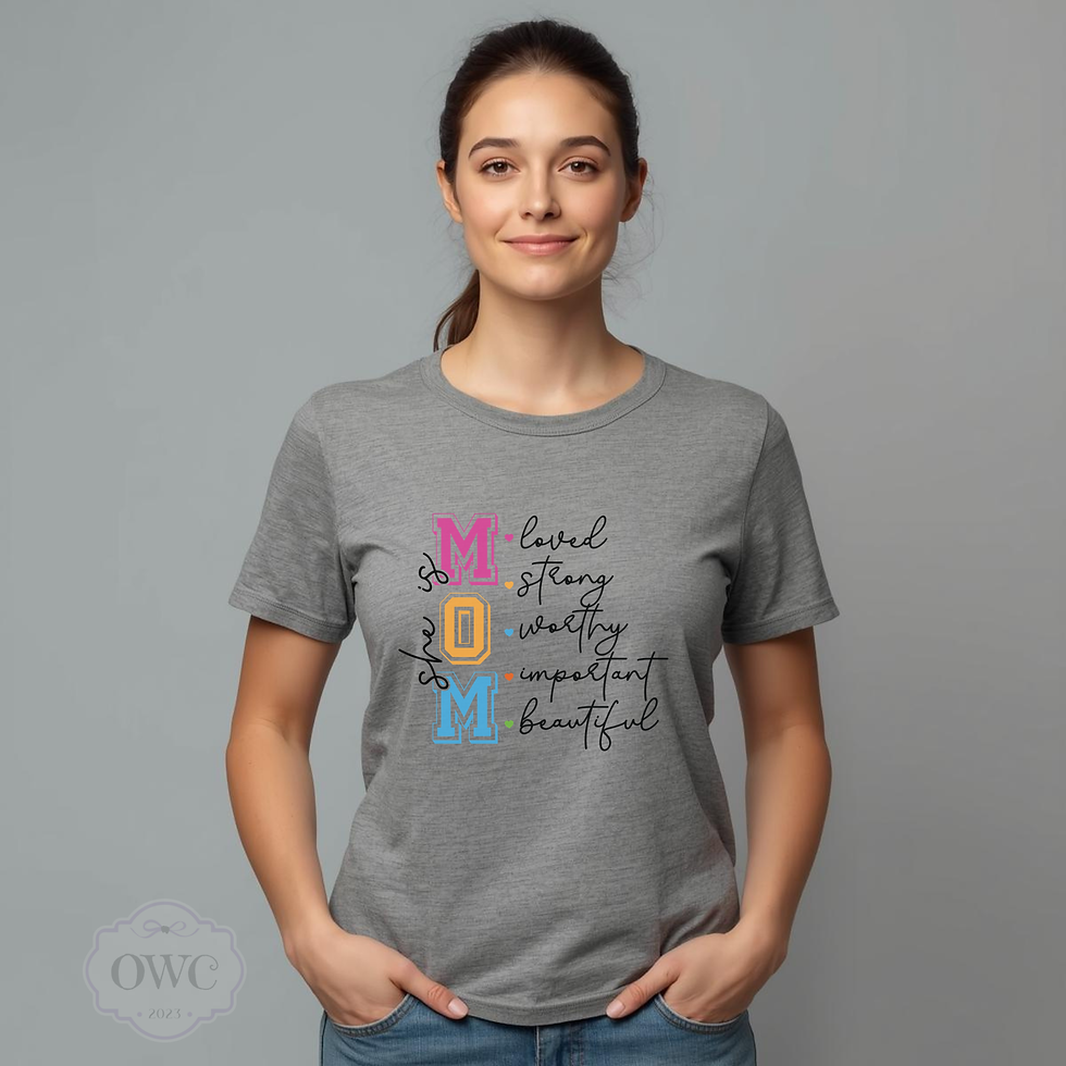 woman wearing gray she is mom affirmation graphic shirt