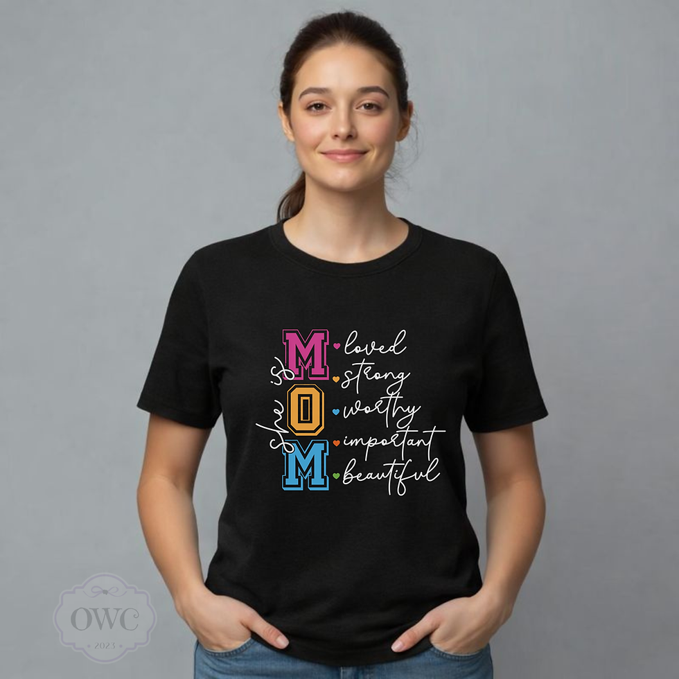 woman wearing black she is mom affirmation graphic shirt