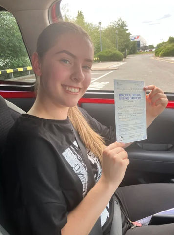 blonde lady passing test in carpark 
