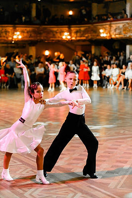 Children in competition in white dress and shirt