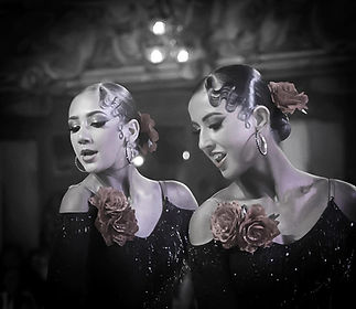 2 girls in the middle of a dance