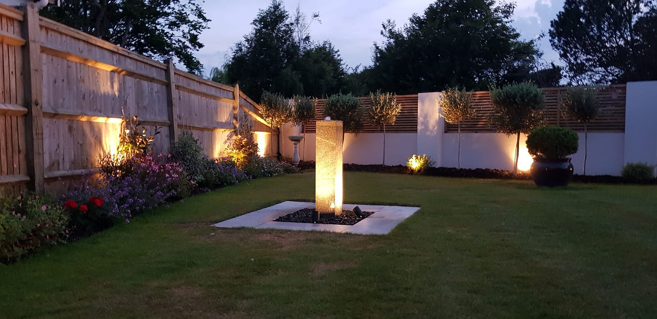 garden setting with outside lighting installed