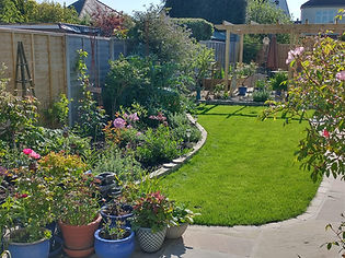 Garden that has been landscaped with new green grass and new outline details