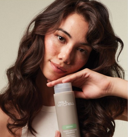 Curly brown hair lady with paul mitchell shampoo