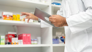 pharmacist in white coat - long term disability for pharmacists