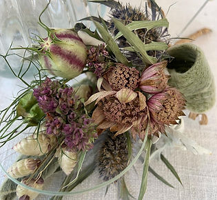 Corsage of dried flowers, seed heads, moss and grasses