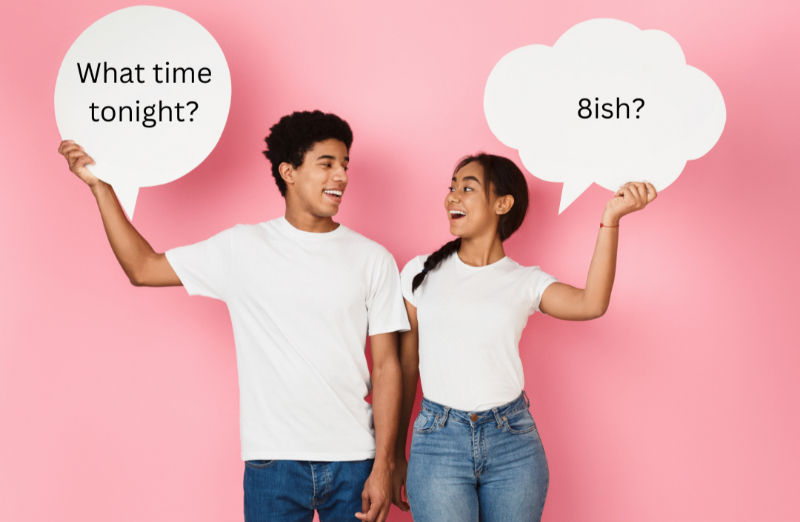 Two smiling people in white shirts and jeans hold speech bubbles on a pink background. Text: "What time tonight?" and "8ish?"