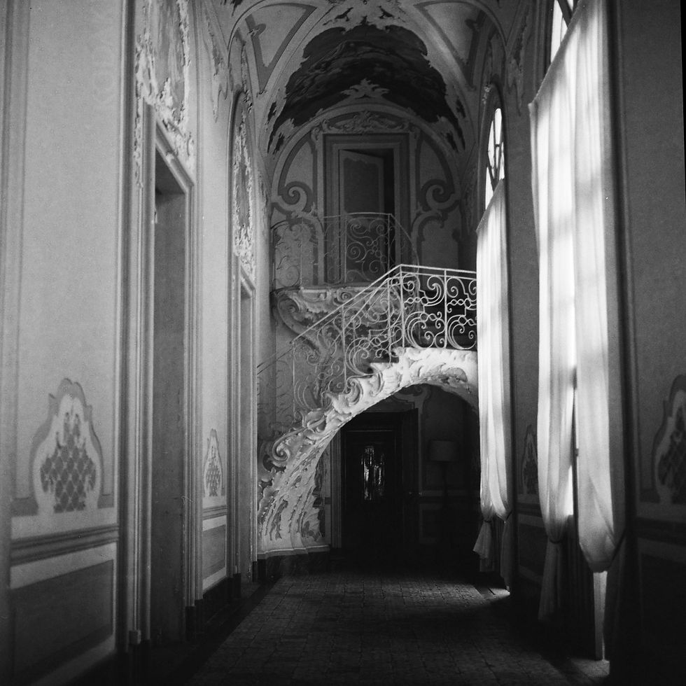 120mm black and white film photo of a haunted Italian Pallazzo