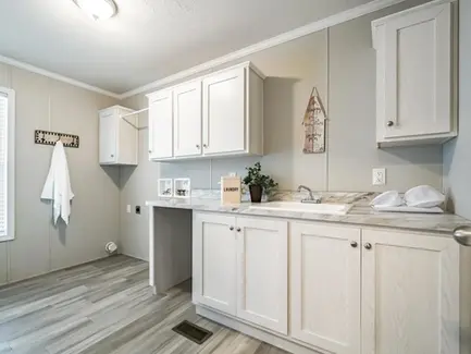 Redman Homes 2020 Louisville Show Model Laundry Room. Custom Built Mobile and Modular Homes from Manufacturers like Redman Homes, Clayton Homes and Champion Homes. Custom built for Turnkey Communities properties. 