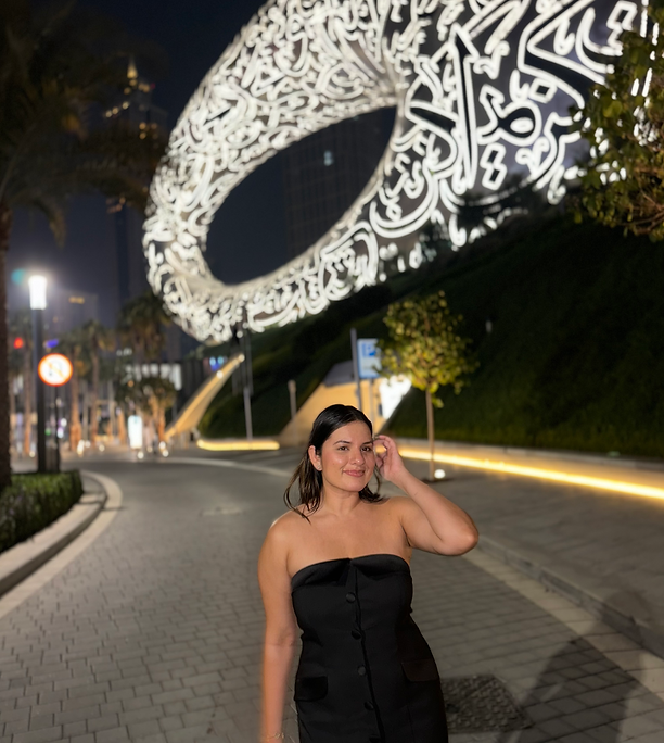 Karnica Karda posing in front of Dubai's Museum of the Future.