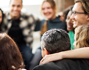 Small group chatting in a circle, symbolizing the supportive Care Circles Lowkey builds for users.