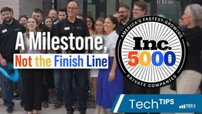 Tier 3 Technology team members standing outside office with overlay text, "A Milestone, Not the Finish Line." Included is the Inc. 5000 badge. In the bottom right corner there is a blue banner with white text overlay that reads, "Tech Tips."