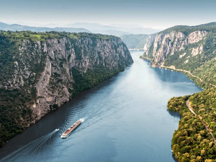 River cruise ship sailing in a river gorge