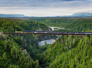 Train going over a bridge in Alaska